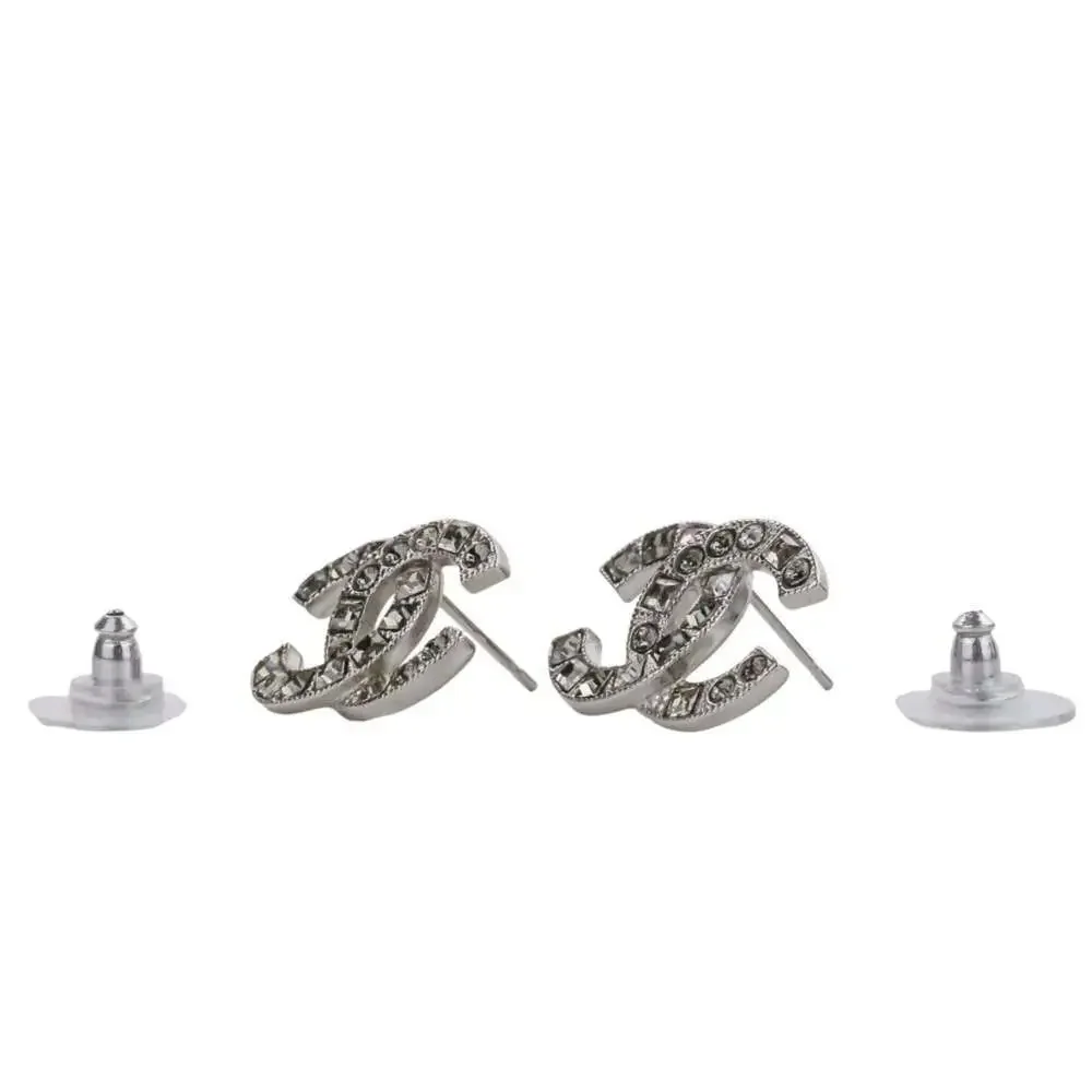 CHANEL Silver Logo Earrings